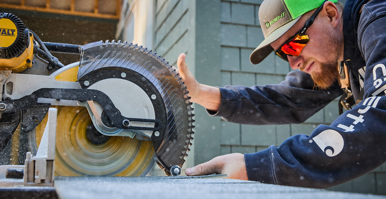 Worker sawing AZEK Product