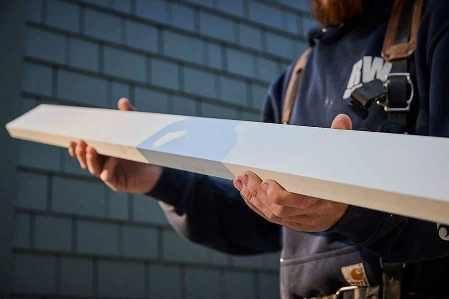 Worker Carrying AZEK Material