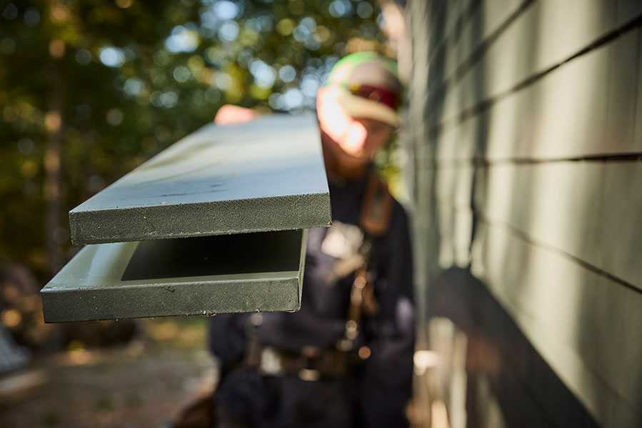 Worker Carrying Multiple AZEK Boards
