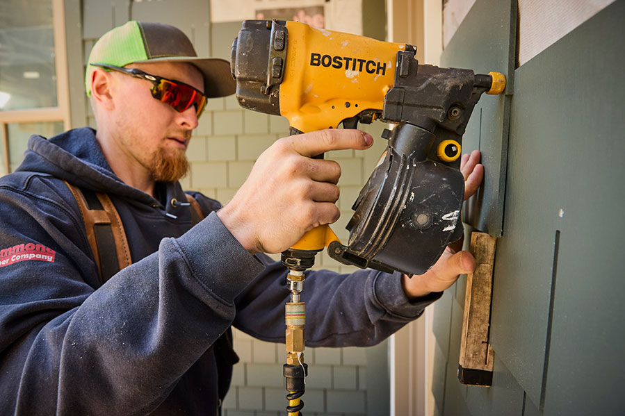 Worker Installing AZEK Shingle Siding